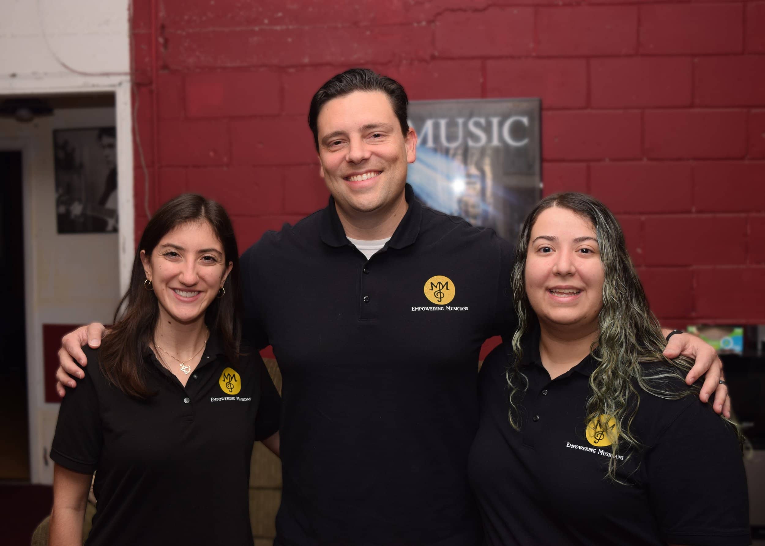 Michael Mingoia with M3 Studios music teachers at their Patchogue, New York school
