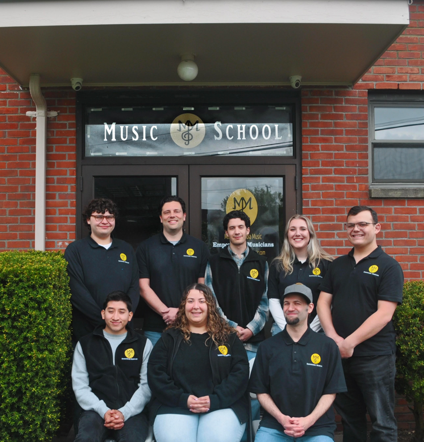 Michael Mingoia and the full M3 School of Music staff team outside their Patchogue, NY location